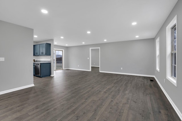 unfurnished living room with dark hardwood / wood-style flooring