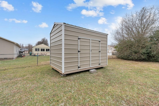 view of outbuilding with a lawn