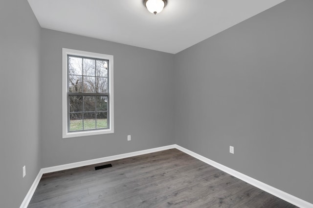 empty room featuring hardwood / wood-style flooring