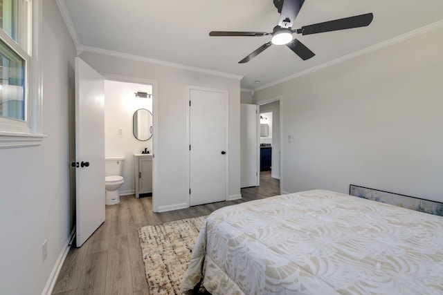 bedroom with ceiling fan, ensuite bathroom, ornamental molding, and light wood-type flooring