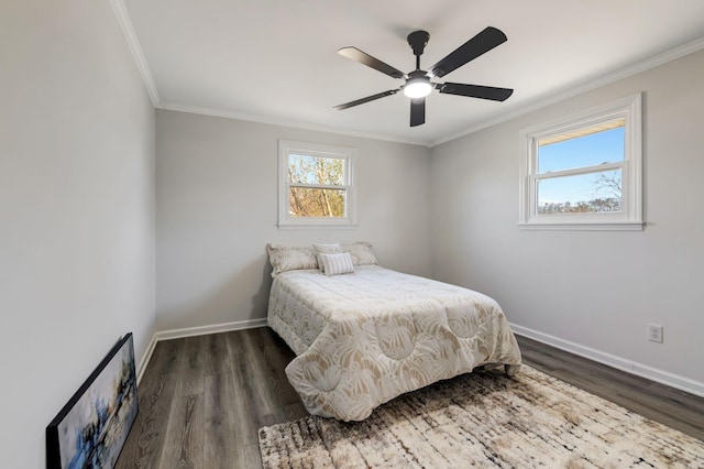 bedroom featuring ceiling fan, dark hardwood / wood-style flooring, multiple windows, and ornamental molding