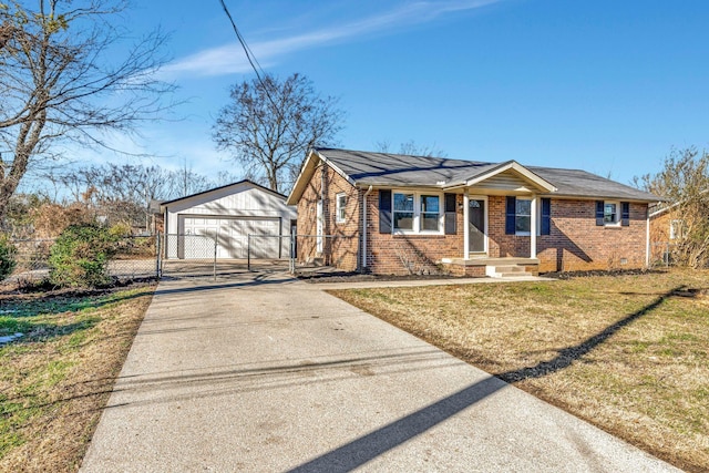 view of front of home with an outbuilding, a front lawn, and a garage