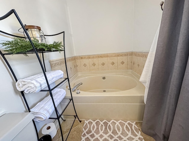 bathroom with tile patterned floors, toilet, and a bathing tub