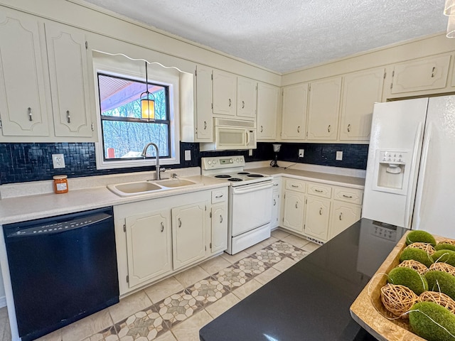 kitchen with sink, a textured ceiling, white appliances, decorative backsplash, and white cabinets