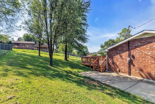 view of yard with a patio area and a deck