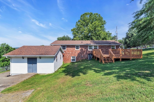 back of house with a yard and a wooden deck