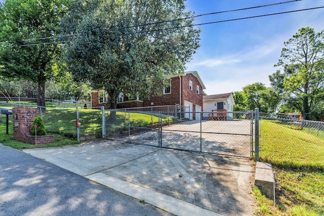 view of front of home featuring a front lawn and a garage