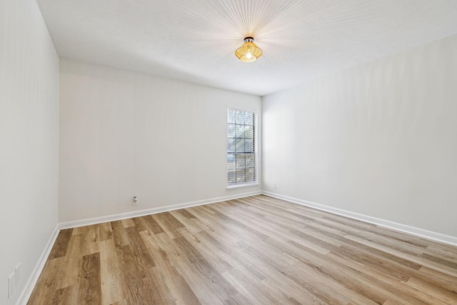 unfurnished room featuring light hardwood / wood-style flooring