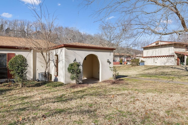 view of outbuilding with a lawn