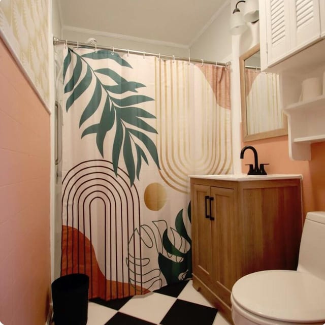 bathroom featuring toilet, vanity, a shower with curtain, and ornamental molding