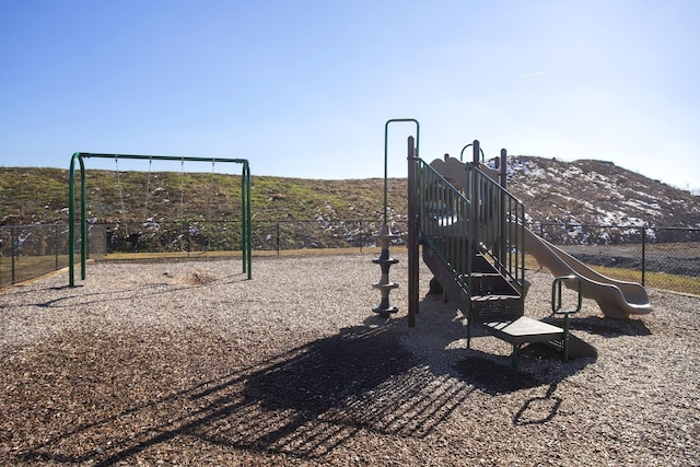 view of playground featuring a mountain view