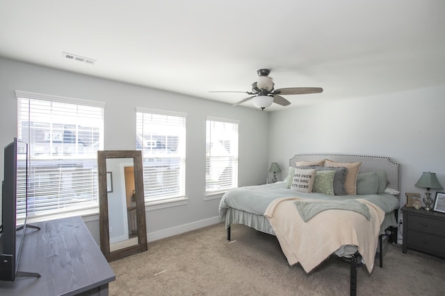 bedroom with ceiling fan and carpet floors