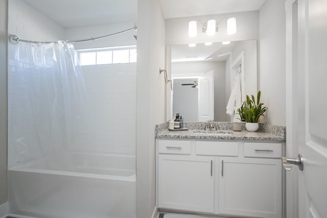 bathroom featuring vanity and shower / bath combination with curtain