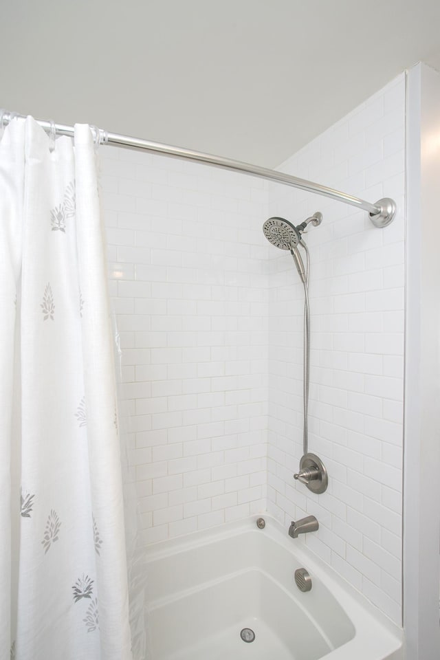 bathroom featuring shower / bath combination with curtain