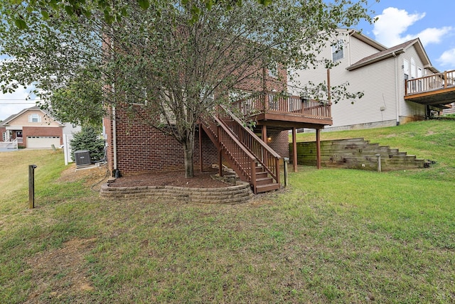 back of property featuring central AC unit, a deck, and a yard