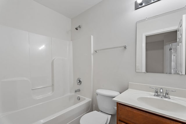 full bathroom with toilet, vanity, and  shower combination