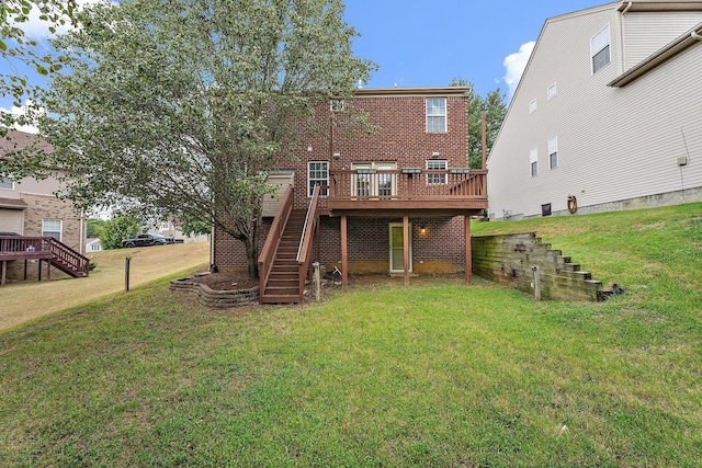 back of house featuring a deck and a yard