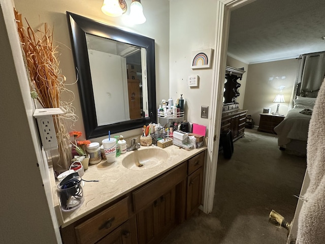 bathroom featuring ornamental molding and vanity