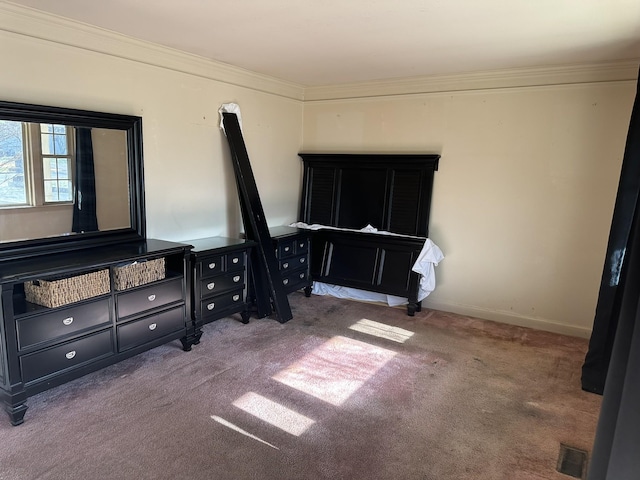 bedroom featuring carpet floors and crown molding