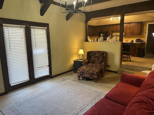 carpeted living room with beam ceiling and a chandelier