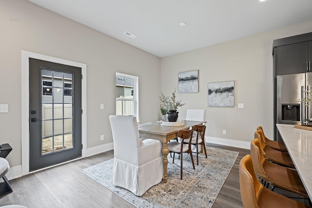 dining area with light wood-type flooring