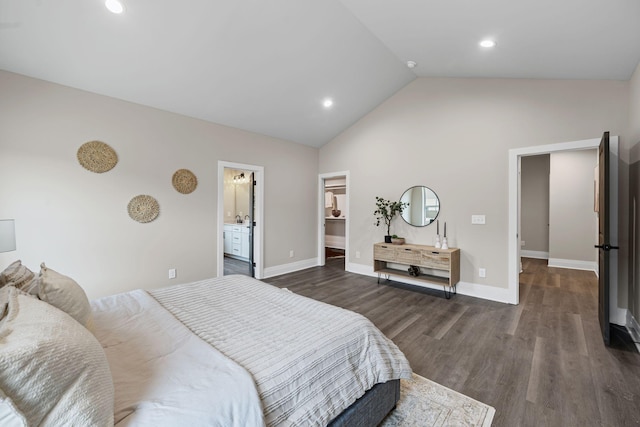 bedroom featuring dark wood-type flooring, lofted ceiling, and connected bathroom