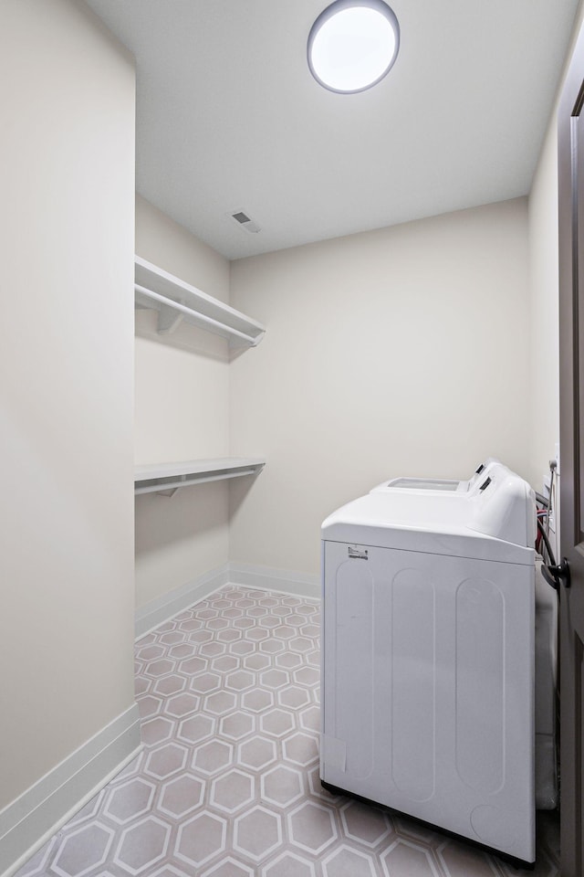 washroom with washer and dryer