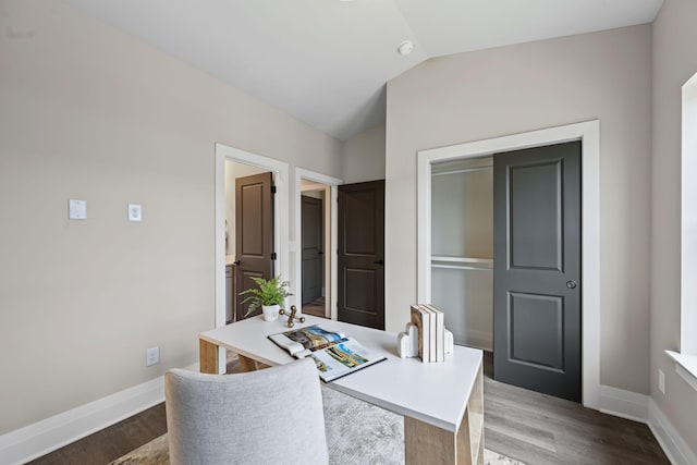 office area with vaulted ceiling and wood-type flooring