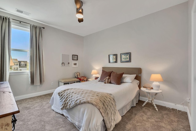 bedroom featuring ceiling fan and carpet