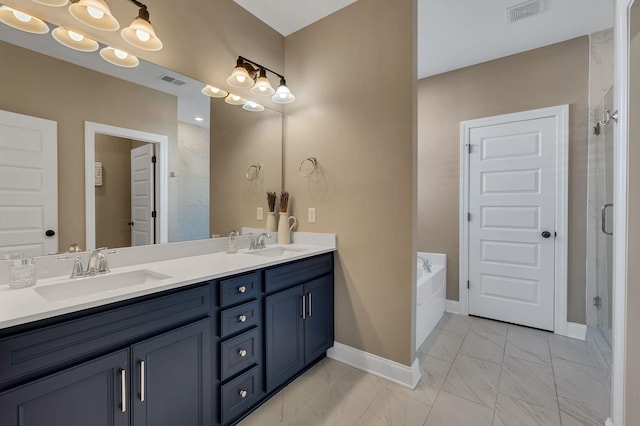 bathroom with vanity and independent shower and bath