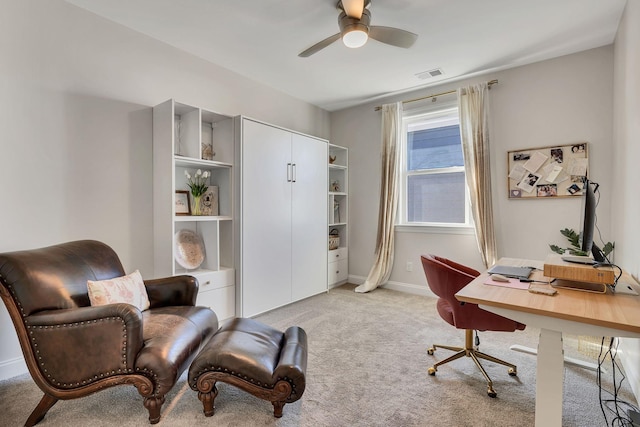 office area with ceiling fan and light colored carpet