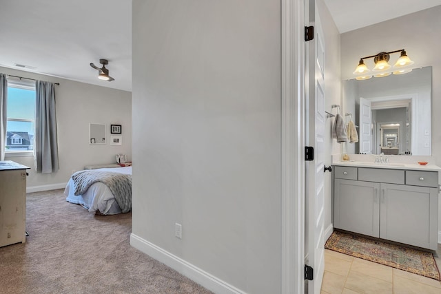 bathroom with vanity and tile patterned flooring