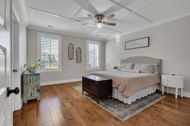 bedroom featuring dark hardwood / wood-style flooring, crown molding, multiple windows, and coffered ceiling