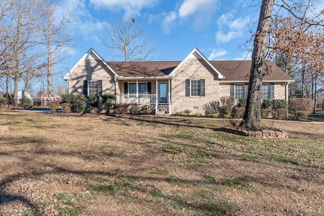 single story home with covered porch and a front lawn