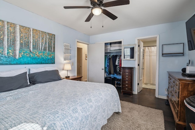 bedroom featuring ceiling fan, connected bathroom, dark hardwood / wood-style flooring, and a closet