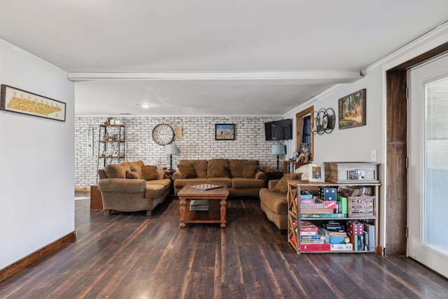 living room with dark wood-type flooring and brick wall