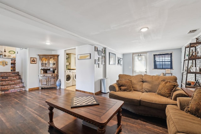 living room with dark wood-type flooring and washer and dryer