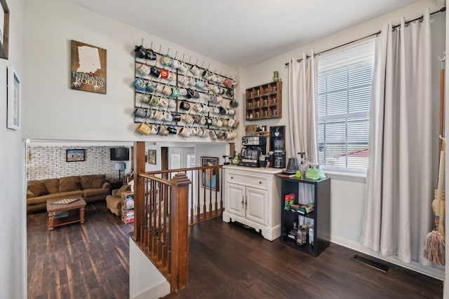 office with dark hardwood / wood-style floors