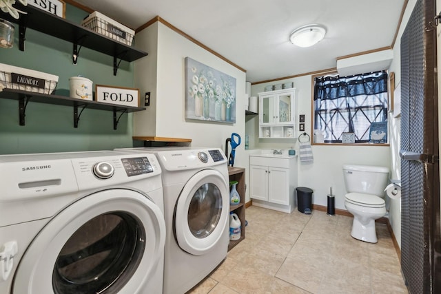 clothes washing area with sink, light tile patterned floors, ornamental molding, and washing machine and dryer