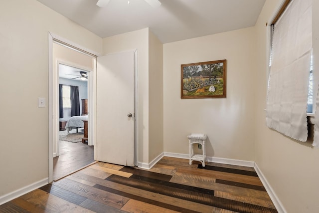 corridor featuring dark hardwood / wood-style floors