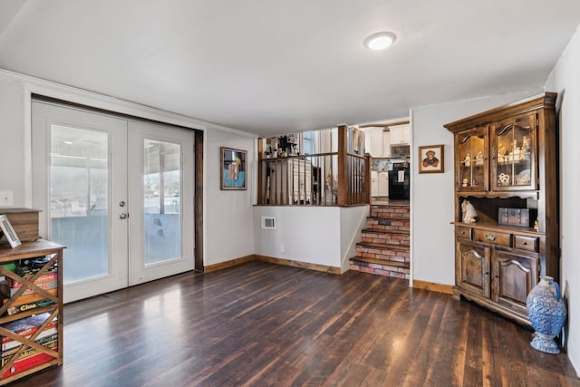 living room featuring dark wood-type flooring and french doors