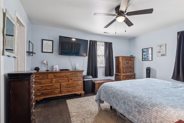 bedroom with ceiling fan and dark hardwood / wood-style flooring