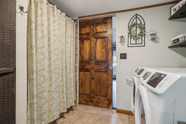 laundry room featuring light tile patterned floors and independent washer and dryer