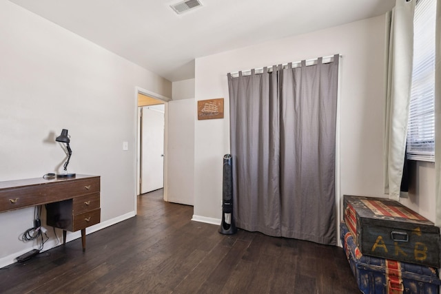 home office with dark hardwood / wood-style floors