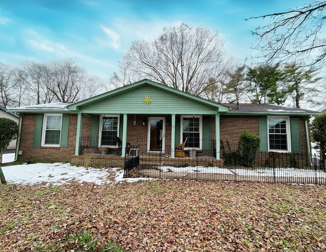 single story home featuring covered porch