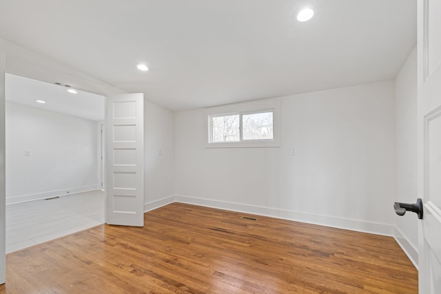 interior space featuring vaulted ceiling and hardwood / wood-style flooring