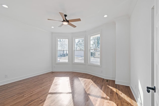 spare room featuring ceiling fan, crown molding, and hardwood / wood-style floors