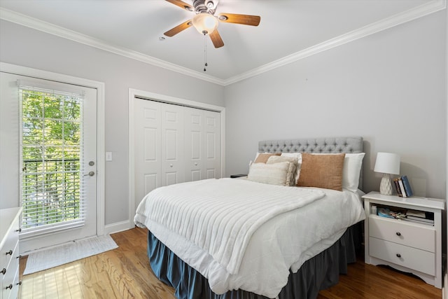 bedroom with ceiling fan, wood-type flooring, crown molding, and multiple windows