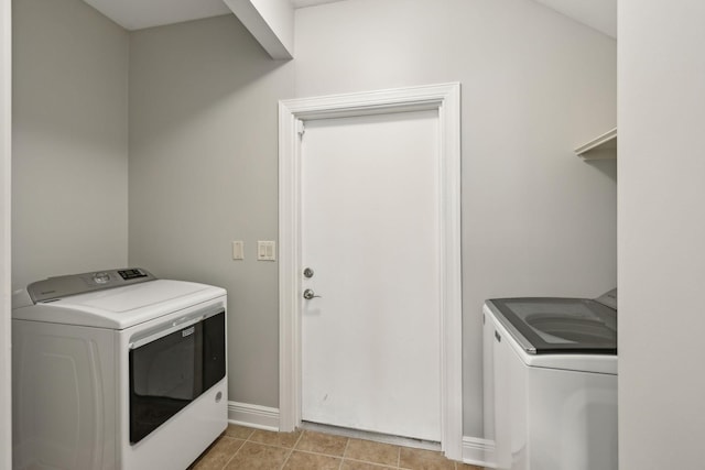 washroom featuring light tile patterned floors and independent washer and dryer