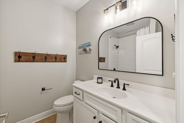 bathroom featuring vanity, a shower with curtain, tile patterned floors, and toilet